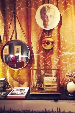 Mirror books and decorative plates at Chez Dd
